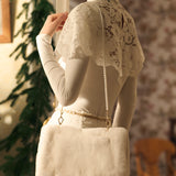 Меховая муфта с жемчужной цепочкой